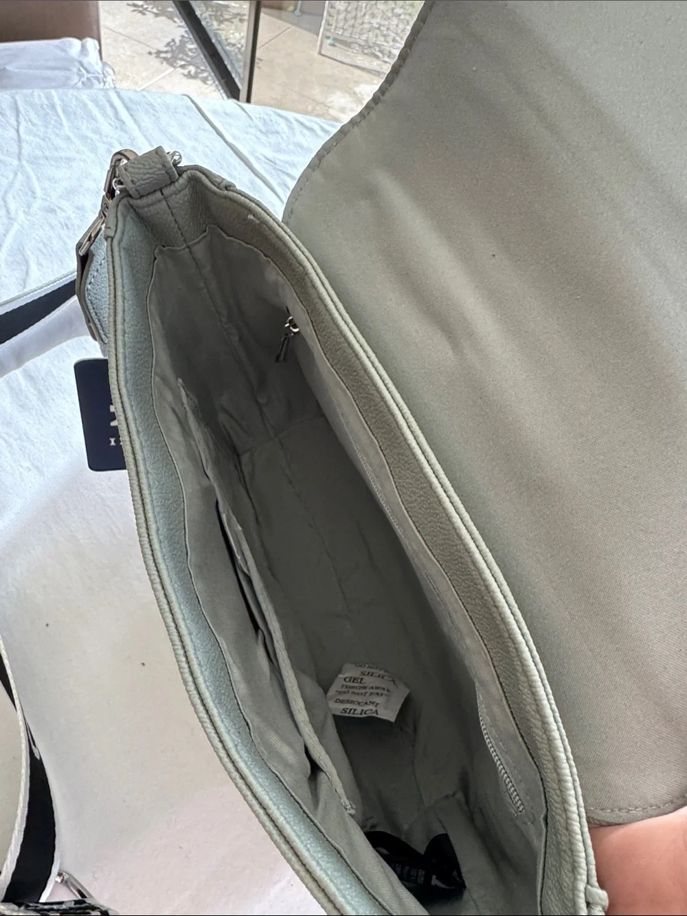 Izod Sage Pebbled Saddle Crossbody with Branded Strap